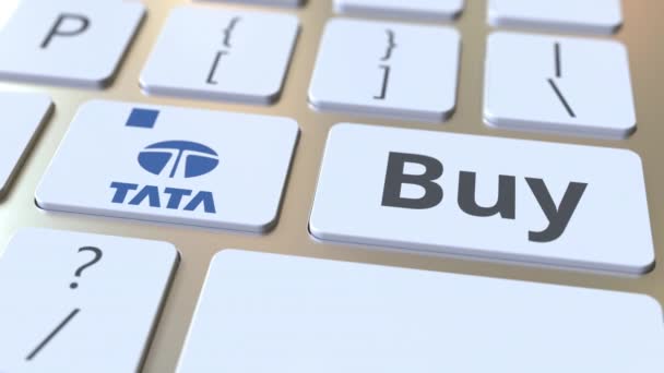 Tata логотип компанії та купити текст на клавішах комп'ютерної клавіатури, редакційна концептуальна анімація — стокове відео
