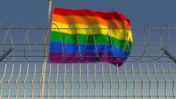 Alambre de púas contra borrosa ondeando bandera de orgullo gay. Opresión LGBT representación 3D conceptual —  Fotos de Stock