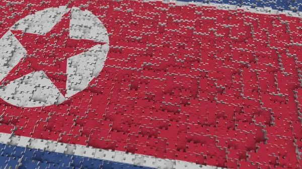 Vlag van Noord-Korea wordt gemaakt met stukjes van de puzzel. Probleem oplossing conceptuele 3D-rendering — Stockfoto