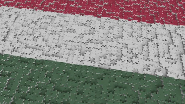 Flag of Hungary being made with jigsaw puzzle pieces. Hungarian problem solution conceptual 3D rendering — Stock Photo, Image