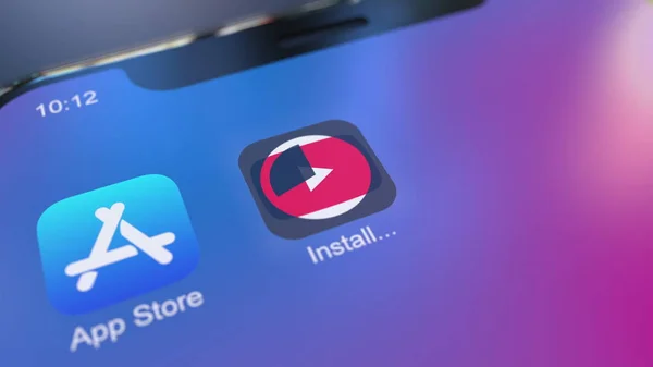 Installing YouTube app on the modern iPhone smartphone. Editorial 3D rendering — Stock Photo, Image