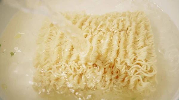 Cooking instant noodles soup close-up shot — Stock Photo, Image