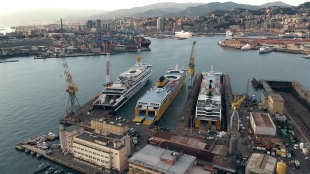 GENOA, ITALY - JANUARY 3, 2019. Aerial shot of Ente Bacini shipbuilding and ship repair facility and the cityscape — Stock Video