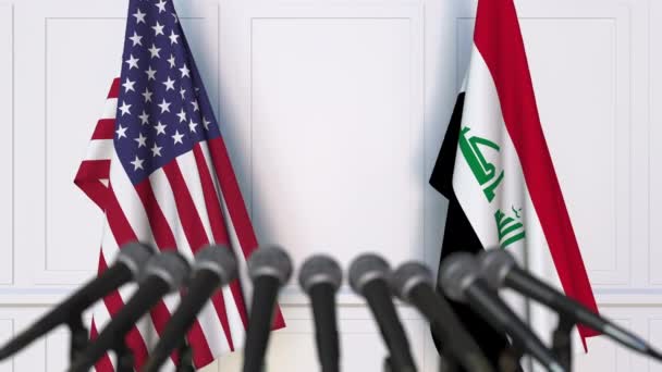 Flags of the United States and Iraq at international meeting or negotiations press conference. 3D animation — Stock Video