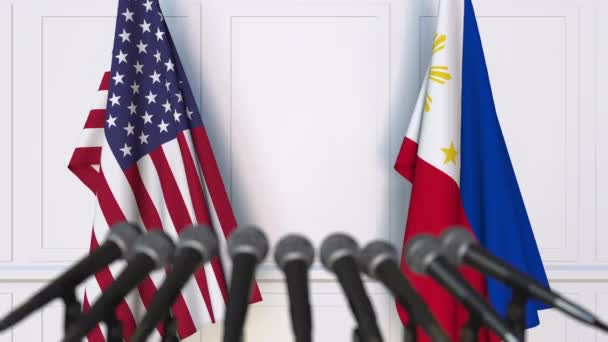 Bandeiras dos Estados Unidos e Filipinas em reunião internacional ou negociações conferência de imprensa. Animação 3D — Vídeo de Stock