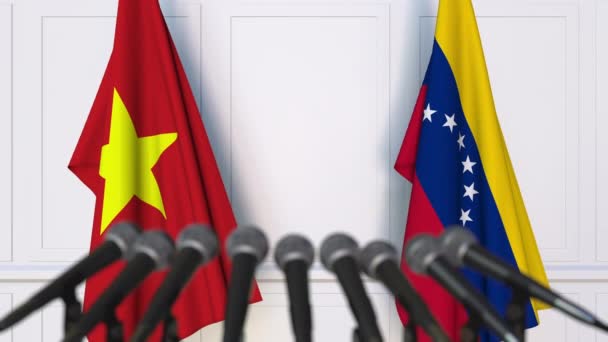 Bendera Vietnam dan Venezuela pada pertemuan internasional atau konferensi pers negosiasi. Animasi 3D — Stok Video