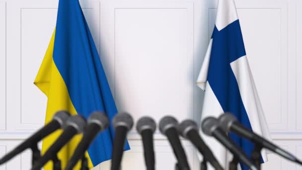 Flagi Ukrainy i Finlandii na międzynarodowej konferencji prasowej spotkania lub negocjacji. animacja 3D — Wideo stockowe