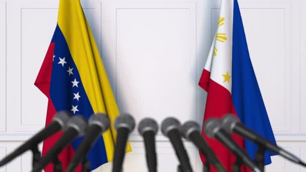 Bandiere del Venezuela e delle Filippine alla riunione internazionale o alla conferenza stampa dei negoziati. Animazione 3D — Video Stock