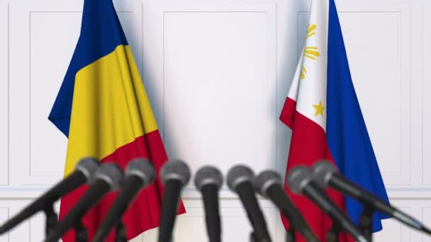 Bandiere della Romania e delle Filippine alla riunione internazionale o alla conferenza stampa dei negoziati. Animazione 3D — Video Stock