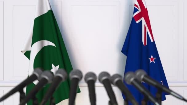 Flaggen Pakistans und Neuseelands bei internationalen Treffen oder Verhandlungen. 3D-Animation — Stockvideo