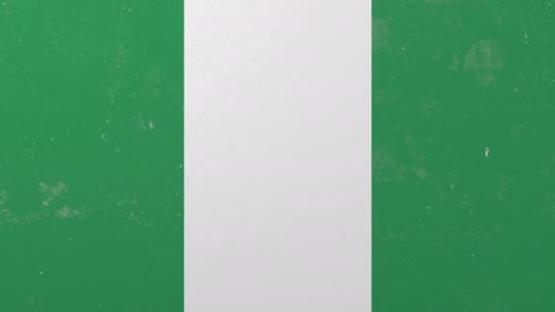 Zerstörende Wand mit bemalter Flagge Nigerias. Konzeptionelle 3D-Animation zur nigerianischen Krise — Stockvideo