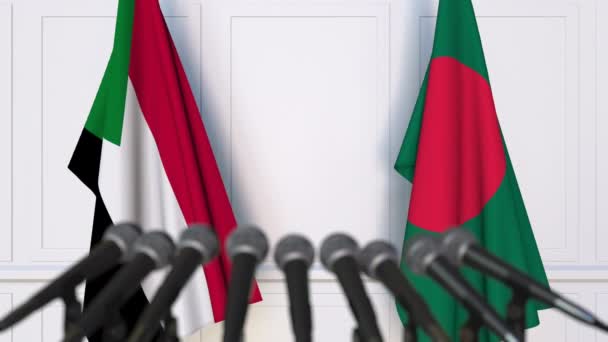 Sudan ve Bangladeş bayrakları Uluslararası Toplantı veya anlaşmalarını basın toplantısında. 3D animasyon — Stok video