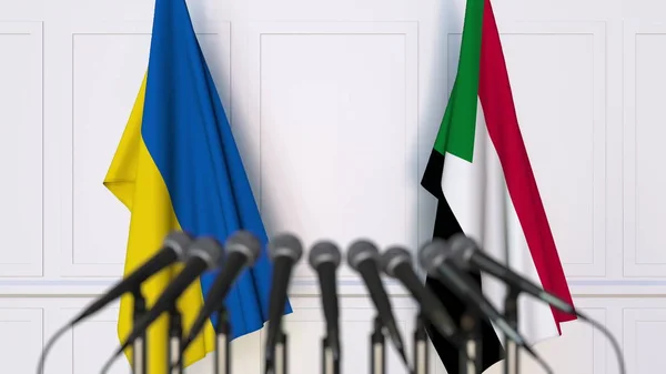 Flags of Ukraine and Sudan at international meeting or negotiations press conference. 3D rendering — Stock Photo, Image