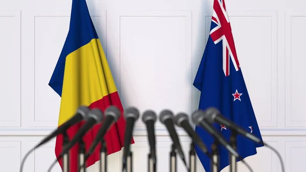 Flaggen Rumäniens und Neuseelands bei internationalen Treffen oder Verhandlungen. 3D-Darstellung — Stockfoto