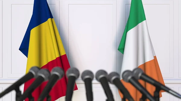 Vlajky z Rumunska a Irska na mezinárodní tiskové konferenci zasedání nebo jednání. 3D vykreslování — Stock fotografie
