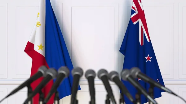 Flagi Filipiny i Nowej Zelandii na międzynarodowej konferencji prasowej spotkania lub negocjacji. renderowania 3D — Zdjęcie stockowe