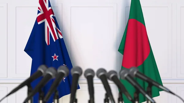 Flags of New Zealand and Bangladesh at international meeting or negotiations press conference. 3D rendering — Stock Photo, Image