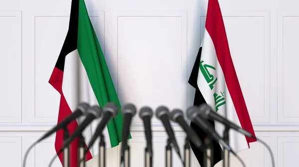 Флаги Кувейта и Ирака на международной встрече или пресс-конференции. 3D рендеринг — стоковое фото