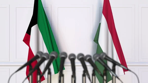 Bandeiras do Kuwait e da Hungria em reunião internacional ou negociações conferência de imprensa. Renderização 3D — Fotografia de Stock