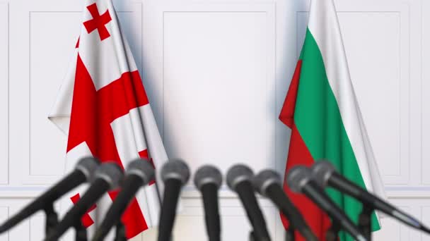 Flags of Georgia and Bulgaria at international meeting or negotiations press conference. 3D animation — Stock Video