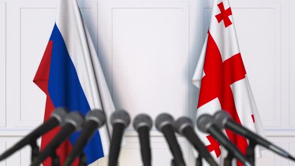 Bandeiras da Rússia e da Geórgia em reunião internacional ou negociações conferência de imprensa. Animação 3D — Vídeo de Stock