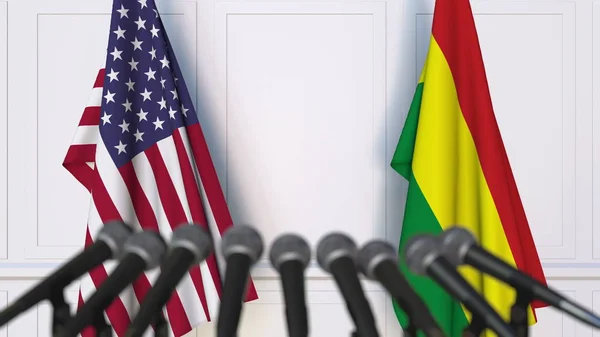 Drapeaux des États-Unis et de la Bolivie lors d'une réunion internationale ou d'une conférence de presse de négociation. rendu 3D — Photo