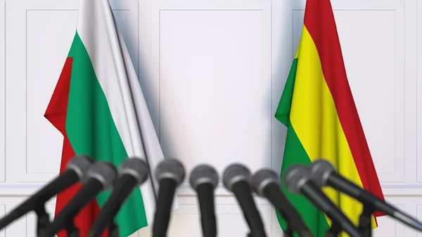 Drapeaux de la Bulgarie et de la Bolivie lors d'une réunion internationale ou d'une conférence de presse. rendu 3D — Photo