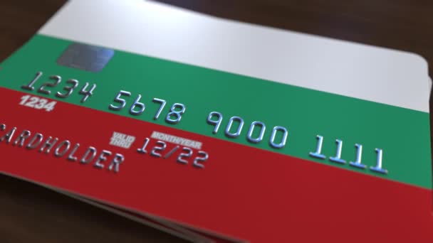 Tarjeta de plástico con bandera de Bulgaria. Sistema bancario búlgaro animación 3D conceptual — Vídeos de Stock