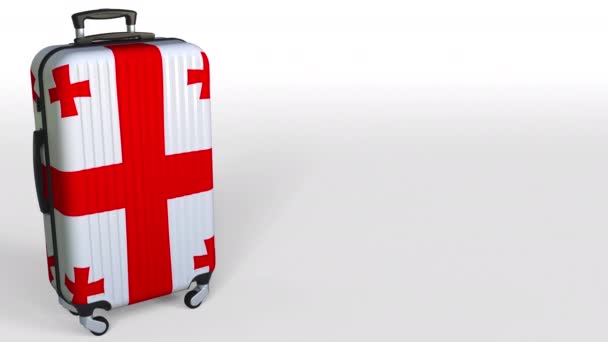 Travelers suitcase with flag of Georgia. Georgian tourism conceptual 3D animation, blank space for caption — Stock Video