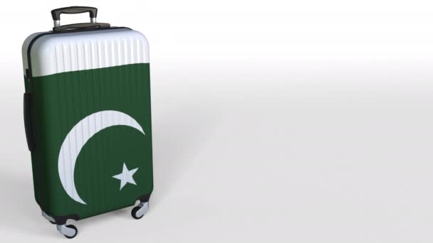 Travelers suitcase with flag of Pakistan. Pakistani tourism conceptual 3D animation, blank space for caption — Stock Video