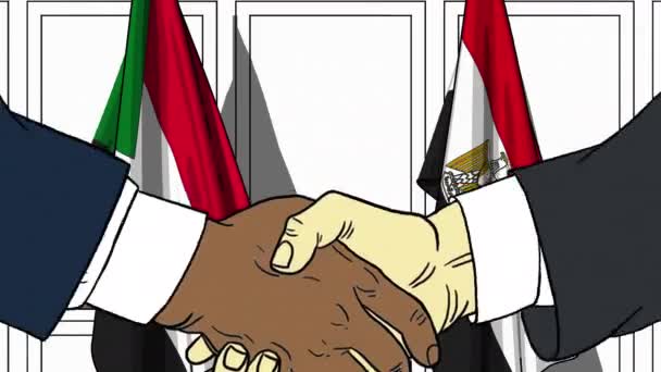 Businessmen or politicians shake hands against flags of Sudan and Egypt. Official meeting or cooperation related cartoon animation — Stock Video