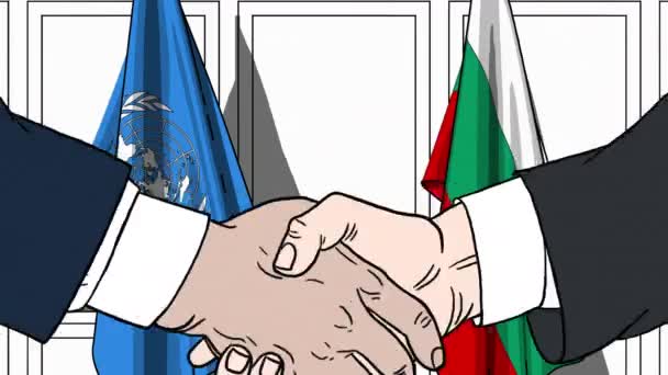 Affärsmän eller politiker skakar hand mot Förenta nationernas och Bulgariens flagg. Officiellt möte eller samarbete relaterad redaktionell animation — Stockvideo