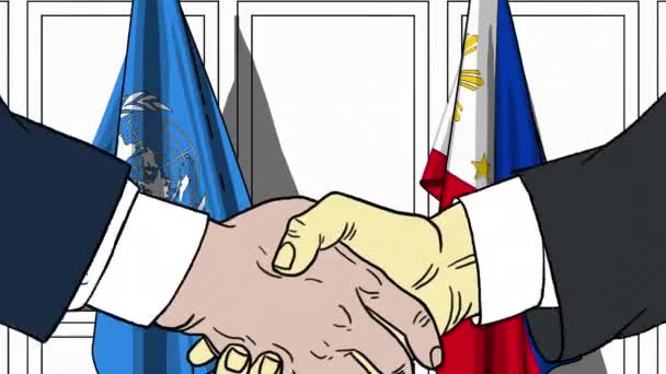 Des hommes d'affaires ou des politiciens serrent la main contre les drapeaux des Nations Unies et des Philippines. Réunion officielle ou animation éditoriale liée à la coopération — Video