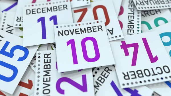 10 de noviembre fecha en hoja de calendario entre otras hojas, renderizado 3D — Foto de Stock
