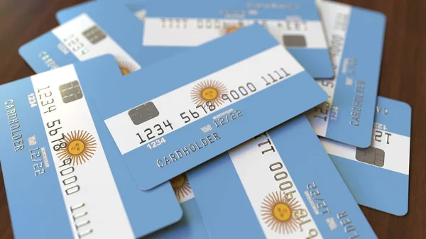 Hromada kreditních karet s argentinskou vlajkou. Argentinský bankovní systém konceptuální prostorové vykreslování — Stock fotografie