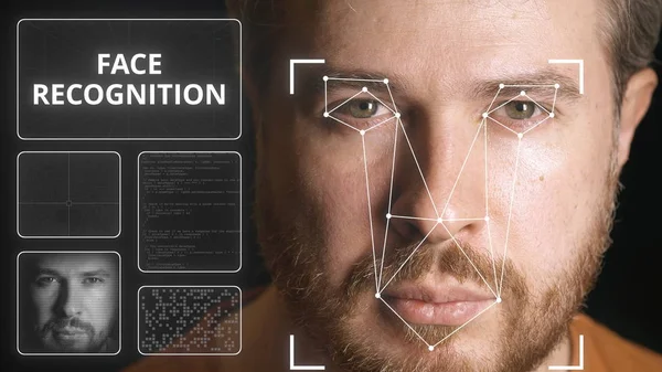Computer system scanning mans face. Face recognition related image