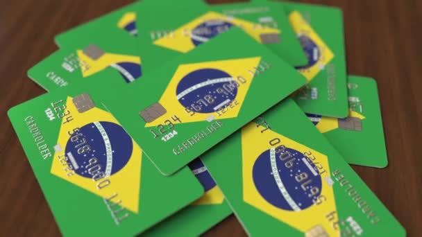 Montón de tarjetas de crédito con bandera de Brasil. Sistema bancario brasileño animación 3D conceptual — Vídeos de Stock