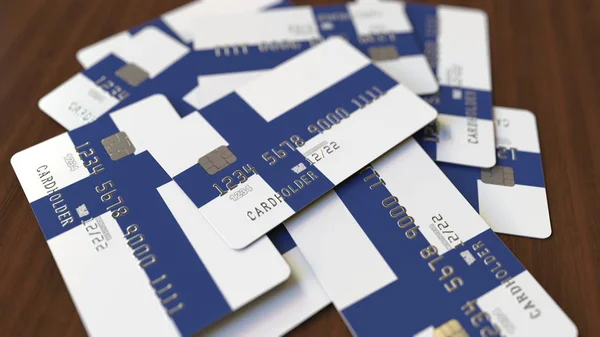 Stapel von Kreditkarten mit der Flagge Finnlands. Konzeptionelle 3D-Darstellung des finnischen Bankensystems — Stockfoto