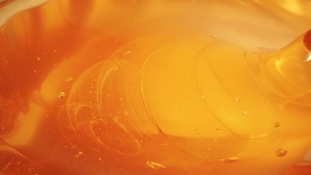 Glass honey dipper, slow motion close-up shot — Stock Video