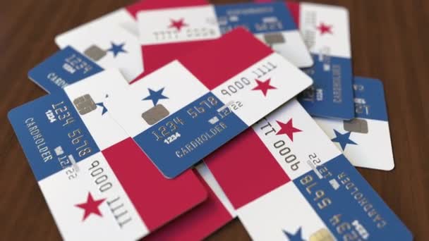 Högen av kreditkort med flagga av Panama. Panamian banking system Konceptuell 3D-animering — Stockvideo