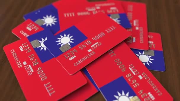 Montón de tarjetas de crédito con bandera de Taiwán. Sistema bancario taiwanés animación 3D conceptual — Vídeo de stock