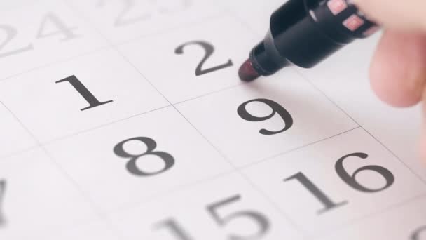 Marque en el noveno 9 día de un mes en el calendario, primer plano — Vídeo de stock