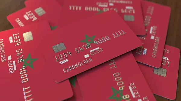 Högen av kreditkort med flagga av Marocko. Marockanska banksystemet konceptuella 3D rendering — Stockfoto
