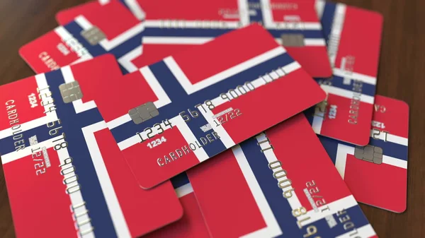 Pile of credit cards with flag of Norway. Norwegian banking system conceptual 3D rendering — Stock Photo, Image