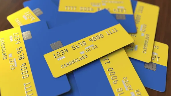 Hromada kreditních karet s vlajkou Ukrajiny. Ukrajinský bankovní systém konceptuální prostorové vykreslování — Stock fotografie