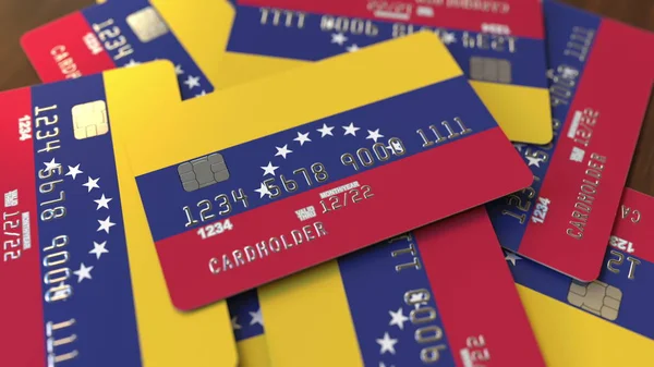 Högen av kreditkort med flagga av Venezuela. Venezuelansk banksystem Konceptuell 3D-rendering — Stockfoto