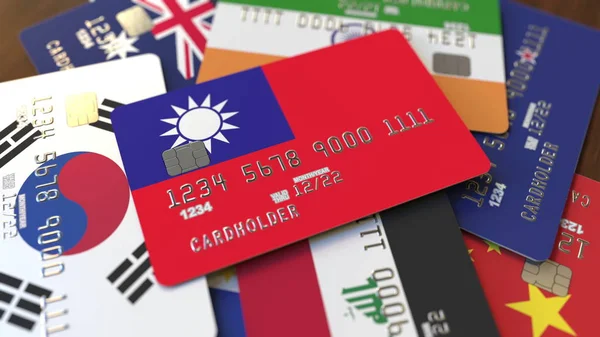 Muitos cartões de crédito com bandeiras diferentes, enfatizou cartão bancário com bandeira de Taiwan. Renderização 3D — Fotografia de Stock