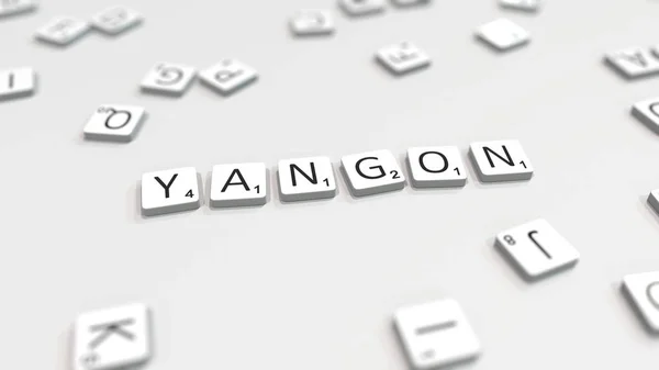 YANGON nome da cidade sendo composto com letras scrabble. Renderização 3D editorial — Fotografia de Stock