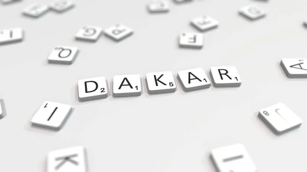 Het maken van de naam van de Dakar-stad met Scrabble brief tegels. Redactionele 3D-rendering — Stockfoto