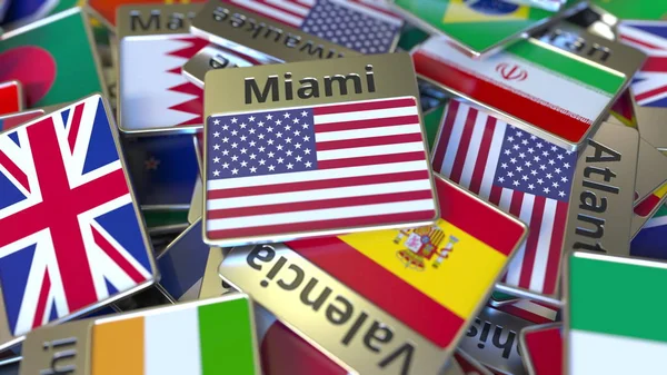 Souvenir magneet of badge met Miami tekst en nationale vlag onder verschillende. Reizen naar de Verenigde Staten conceptuele 3D-rendering — Stockfoto